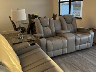 Living room with two loveseats, one set reclines