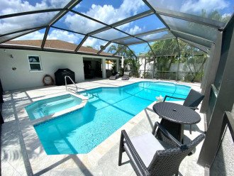 Heated pool/spa w/chaise lounges, bistro set, Weber LP grill and outdoor shower.