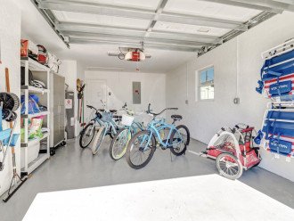 Beach items and bikes are stored in the garage.
