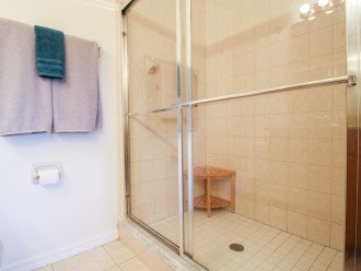 Primary bath with tiled shower and double sinks