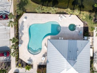 aerial view of heated pool and spa
