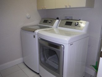 Laundry room with newer LG washer and dryer