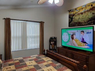 primary bedroom, king bed and 70 inch 1080P tv