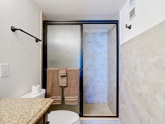 En suite Bath features a walk in shower