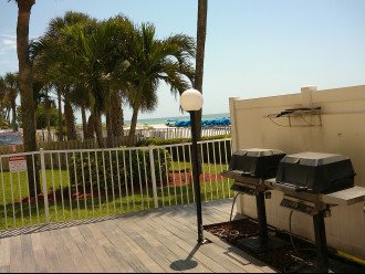 Grilling area on pool deck with pool & Gulf views