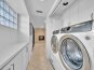 Laundry room located behind the kitchen