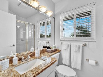 The En-suite bathroom off the upstairs guest room has a shower and includes Latitude Key's signature spa soaps.