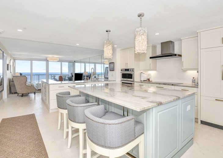 View as you walk into the condo. An island in the kitchen provides ocean views.