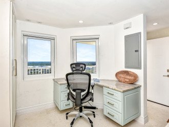 A desk off the kitchen features views of the river.