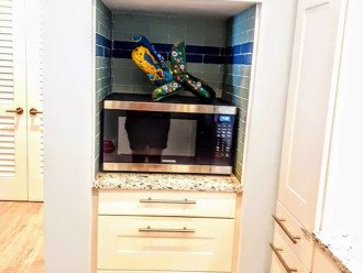 Microwave with contained trash/recycle drawer below.