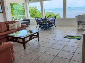 View from livingroom through sunroom to the east w/Little Palm Island in view