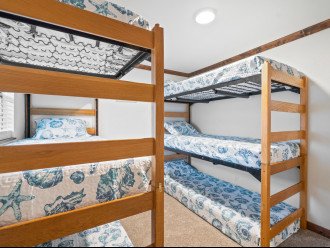 Bunk room on 2nd floor with 6 twin XL beds and TV (bunk rails provided in closet)