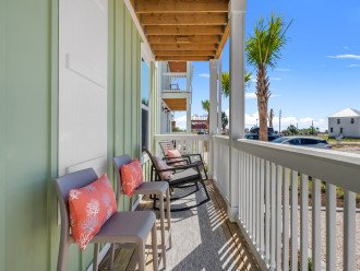 Enjoy the coastal breezes from the front porch of Cast Your Cares