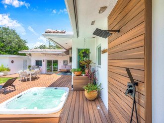Indulge Your Senses: Luxuriate in the Private Hot Tub, Then Refresh Under the Cascading Waters of the Built-In Shower. Your Ultimate Spa Retreat Beckons!