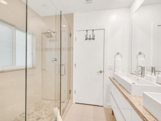 Experience Opulence in Our En Suite Bathroom, Boasting Double Vanities, a Serene Walk-In Shower, and Luxury Soaps. Your Indulgent Oasis Awaits.