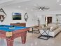 Play a game of pool and enjoy the views of the waterways and heated pool.
