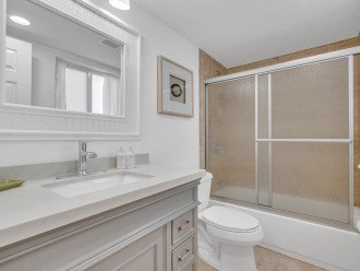 The en-suite bathroom has a shower/tub condo and includes Latitude Key's signature spa soaps.