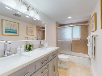 The bathroom features a double vanity.