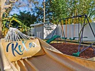 Soak up the sun in the zen-inspired backyard while relaxing in a hammock
