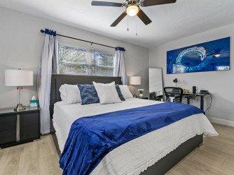 Ride the wave in the primary bedroom with King bed and flat screen tv