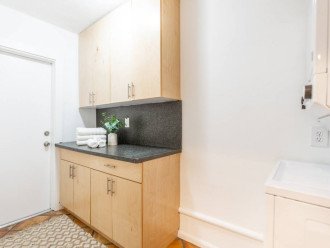 Laundry room with lots of counter space backyard access