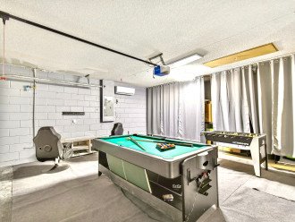 Games room with pool and foosball tables
