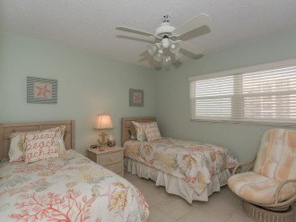 Twin beds plus a swivel chair in the second bedroom. Closet space and fans at no extra charge!