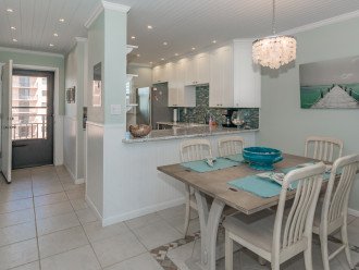 The open kitchen allows you to visit with your chef, or just pass your dinner through the open concept kitchen counter.