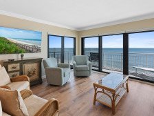 Beautiful corner unit with oceanfront views and wrap around balcony!