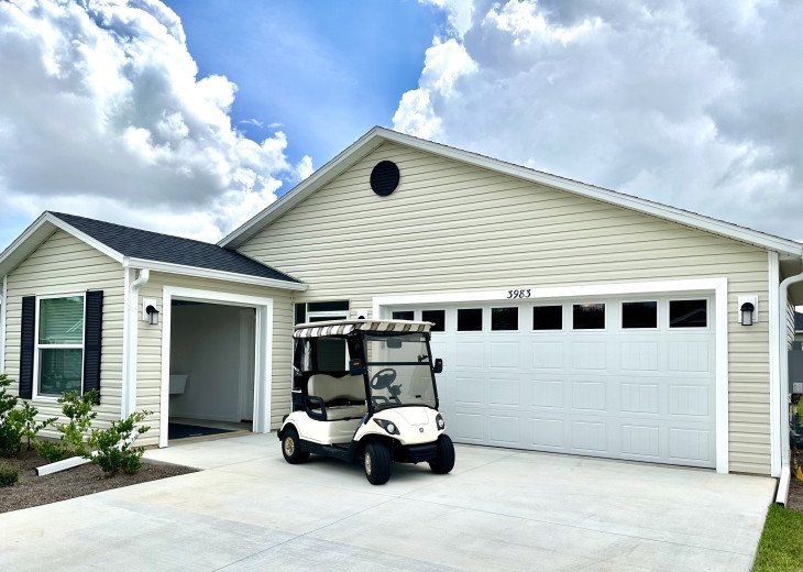 Newly constructed home on a corner lot. 2 Car Garage plus 1 car golf cart garage