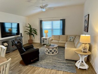 Spacious open concept with leather sectional and recliner for relaxing