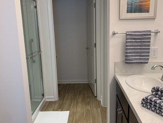 Master bath with double sinks, walk in shower, and walk in closet.