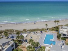 Updated 2 bedroom 2 bath canal front condo with heated ocean front pool