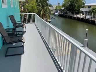 Wrap around balcony overlooking canal with peakaboo view of Ocean