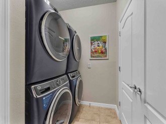 2 washing machines and 2 dryers in laundry room
