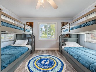guest bedroom with 4 beds