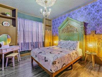 Haunted Mansion Room with a Queen Size Bed and Makeup area