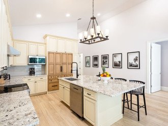 Open kitchen with island seating and premium appliances