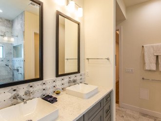 Master bathroom with double vanity and walk-in shower