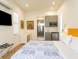 Cabana with queen bed, kitchenette, tv and private bathroom