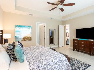 Master bedroom with tv and king size bed