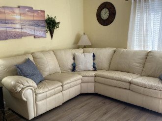 Leather Sectional with recliner on one end and Sleeper Sofa on the other side