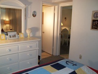 Guest bedroom doors to bathroom and dining area