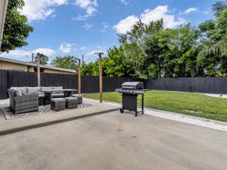 Backyard with outdoor dining area and gas grill!