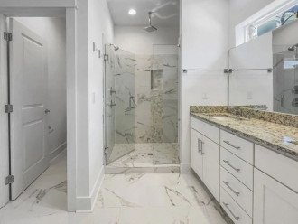 large walk-in shower with dual shower heads