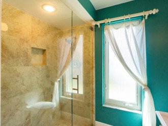 Master bathroom with open single vanity and walk-in shower + single vanity