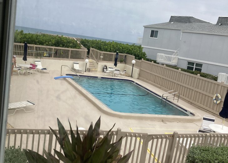 View of pool and ocean beyond from living room.