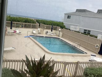 View of pool and ocean beyond from living room.
