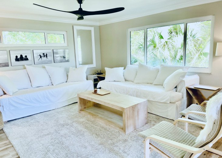 Clean and modern beach-chic living room -tucked into the mangroves and palms