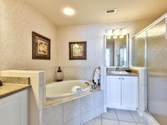 Master Bathroom with Double Vanity, Walk in Shower, and Spa Tub! Perfect Relaxing Tub After a Day in Sunny Naples!